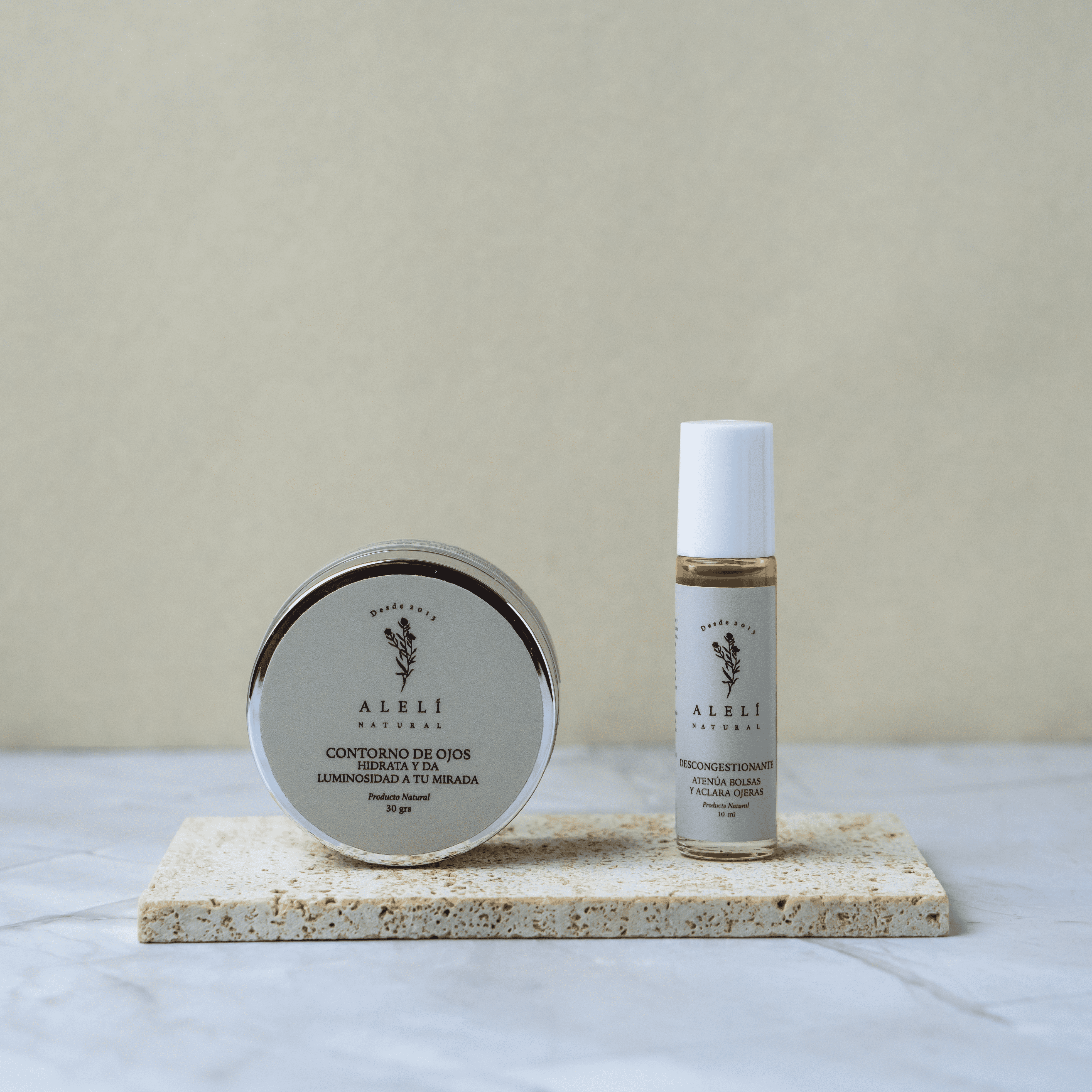 Vista frontal del Pack Mirada Iluminada Alelí Natural, que incluye Sérum Desinflamatorio y Contorno de Ojos Hidratante.