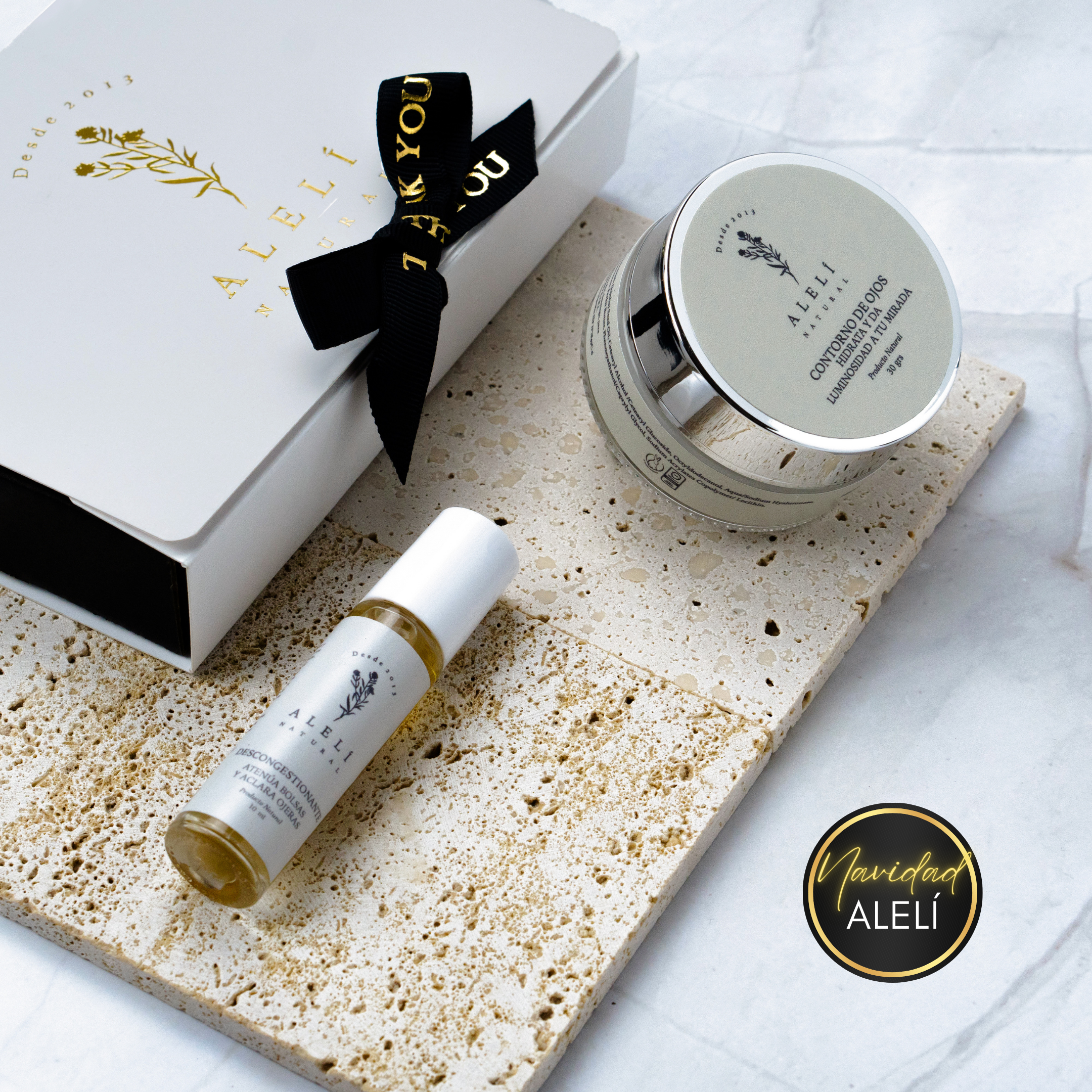 Vista frontal del Pack Mirada Iluminada Alelí Natural, que incluye Sérum Desinflamatorio y Contorno de Ojos Hidratante. Navidad Alelí 35% Off.